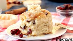 a close up of a plate of food with cranberry bread on the side