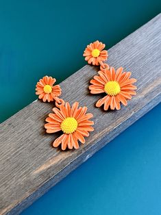 These vintage orange stud earrings are a must-have for any fashion-forward individual. The stunning orange color brings a pop of brightness to your outfit, making you stand out from the crowd. Eye-catching Design: The earrings feature beautiful spring daisy flowers that are sure to catch everyone's attention. Perfect Gift: These vintage earrings make the perfect gift for any occasion. Surprise your loved ones with this unique and thoughtful present. The high-quality construction ensures durability, so you can wear them every day without worrying about damage or wear and tear. These earrings are versatile enough to be worn with casual or formal attire, making them a perfect addition to your jewelry collection. Add some floral elegance to your style with these chic vintage orange flower stud Retro Flower Earrings For Gift, Retro Flower-shaped Earrings For Gift, Trendy Flower Earrings For Gift, Retro Flower Shaped Earrings For Gift, Retro Flower Shaped Earrings As Gift, Retro Flower Shape Earrings For Gift, Orange Earrings For Spring Gift, Handmade Orange Flower Earrings, Spring Gift Orange Earrings