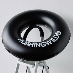 an inflatable chair with the words roaring wild on it sitting on a stool