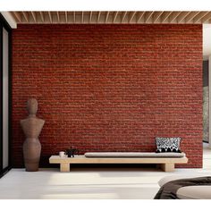 a living room with red brick walls and white flooring on the wall is shown