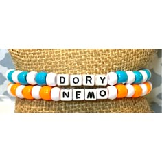 Set Of 2 Dory And Nemo Bead Friendship Bracelet Osfm Nwt Features: 1 Bead Bracelet That Says Dory With White & Blue Plastic Beads *1 Bead Bracelet That Says Nemo With Orange & White Plastic Beads *One Size Fits Most *Handmade By My Daughter To Make Extra Money *New Bundle & Save... Reasonable Offers Welcome! Check Out Our Other Handmade Bracelets And More Animal Bead Bracelets, Thing One And Thing Two Bracelets, Thing 1 Thing 2 Bracelets, Clay Beads Friendship Bracelet Ideas, Beaded Bff Bracelets, Clay Bead Bracelet Ideas Lilo And Stitch, Bsf Clay Bead Bracelets, Pony Bead Bracelets Color Combos, Clay Beads Bracelet Ideas Fall