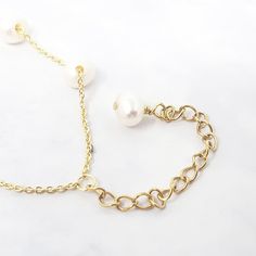 Our Freshwater Pearl Double Chain Wedding Bracelet, crafted with 18ct gold-plated copper and adorned with freshwater pearls, is the perfect elegant gift for brides, bridesmaids, or any special occasion.  Elevate your bridal ensemble with our Freshwater Pearl Double Chain Wedding Bracelet, an exquisite accessory perfect for bridesmaids or brides on their special day.   This jewellery arrives beautifully packaged and ready to gift. It would make a really thoughtful and meaningful birthday gift, Ch Delicate Gold Chain Bracelet With Pearls, 14k Gold-filled Bracelets With Pearl Drop, Gold Bracelets With Pearl Drop In 14k Gold Filled, Dainty Gold Bracelets With Pearl Chain, Dainty Gold Pearl Bracelet With Pearl Charm, Luxury Gold Akoya Pearl Bracelet, Wedding Baroque Pearl Chain Bracelet, Pearl White Bracelets With Pearl Pendant For Weddings, Gold Bracelet With Pearl Charm, 14k Gold Filled