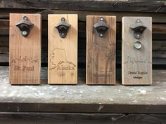 four wooden bottle openers sitting on top of a table