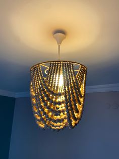 a chandelier hanging from the ceiling in a room