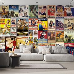 a living room filled with furniture and lots of posters on the wall