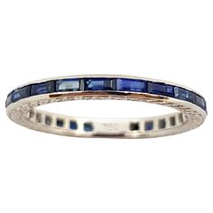 Blue Sapphire 1.01 carat Eternity Ring set in 18 Karat White Gold Settings Width: 2.0 cm Length: 0.2 cm Ring Size: 51 Total Weight: 2.02 grams "We first opened doors in 1980 when it was then situated in the vicinity of the Victory Monument; a small and modest storefront with a couple of counters. From its humble beginnings to where it stands today, our company has proven its abilities as a jeweler. Since the beginning, we have been supplying fine quality pieces to dealers, wholesalers and custom Classic Stackable Sapphire Ring, Anniversary Sapphire Ring In Channel-set Platinum, Anniversary Platinum Sapphire Ring Channel Set, Anniversary Sapphire Ring Channel Set In Platinum, Classic Gemstone Eternity Band, Classic Gemstone Eternity Band For Formal Occasions, Classic Sapphire Eternity Band With Brilliant Cut, Classic Sapphire Ring With Channel Set, Classic Sapphire Eternity Band