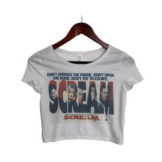 This faded distressed Scream crop top is perfect to dress up or wear casual. The image is sublimated onto the material making the top buttery soft! **This crop top is fitted and runs slightly on the smaller side.** Fabrication: 52% Airlume combed and ring-spun cotton 48% poly Scream Horror Crop Top, Scary Movie Tops for Women, Retro Vintage Spooky Top, Boho Stylish Tops, Summer Tops, Horror Movie Fan Gift, Scream Crop Top, Halloween Crop Top, Vintage Spooky Crop Top, Retro Horror Crop Top, Boho Halloween Crop Top, Vintage Spooky, 포트폴리오 레이아웃, Bauchfreies Top, Retro Horror, Movie Tees, Vintage Crop Tops, Scary Movie, Cropped Tops