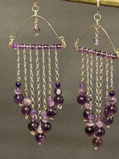 These are one of kind beautiful handmade dangle chandelier earrings with purple Amethyst and a lavender faceted Crystal dangling from the center.  4 mm 6 mm 8 mm round purple amethyst with Sterling silver chain cascading on the chain into a v shape with stacked beads large on the bottom medium and small. This is an amazing production dangling.  Closing with sterling silver LeverBacks. Total measurement 5 inches long including sterling silver lever back earring wire. Noted these earrings are heav Chandelier Earrings Diy, Chain Chandelier, Handmade Chandelier, Lavender Amethyst, Handmade Crystal Jewelry, Crystal Chandelier Earrings, Earring Wire, Jewelry Making Earrings, Making Earrings