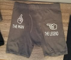 there is a pair of shorts with the words the man and the legend on them