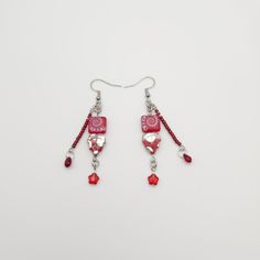 These are the Garnet Fossil Beaded Earrings. They are made with stainless steel fish hook ear wires, stainless steel findings, czech glass beads, and seed beads. Returns are accepted within 21 days as long as the item is in its original condition. The buyer is responsible for return costs and any loss of item value if the item is not in its original condition. Adjustable Beaded Earrings With Heart And Round Beads, Red Czech Glass Beaded Earrings With Dangling Beads, Adjustable Red Czech Glass Beaded Earrings, Metal Heart Bead Earrings As Gift, Heart Beads Metal Earrings As Gift, Heart Beaded Metal Earrings As Gift, Red Czech Glass Earrings With Dangling Beads, Adjustable Czech Glass Beaded Earrings With Dangling Beads, Czech Glass Beaded Drop Earrings