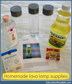 the ingredients for making homemade lava lamp supplies are displayed on a white sheet with blue border