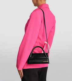 Find JACQUEMUS Leather Le Chiquito Long Top-handle Bag on Editorialist. In the world of boundary-breaking handbags, Jacquemus comes out on top. If you cast your mind back to Spring/Summer 2018, youll recall the debut of the Le Chiquito bag. Sure, it caused a stir due to its miniature proportions, but also its distinctive silhouette. Note how a structured top handle crowns a clean-cut form, while branded gold-tone lettering proudly nods to the creator of this powerfully wider piece. Jacquemus Le Chiquito Long, Le Chiquito Long, Jacquemus Bags, Jacquemus Le Chiquito, Jacquemus Bag, Structured Top, Short Coat Jackets, Swimwear Shorts, Field Jacket