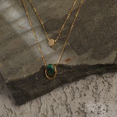 Description Inspired by the beautifully patterned Malachite gemstone, the earliest ore of copper, Tamra is eccentric, contemporary, and distinctively classy. Handcrafted on 925 hallmark silver and gold finish. This collection is curated for everyday luxury. This dual-layer chain necklace features an oval-cut malachite charm and an oval CZ charm suspended from a delicate chain. A striking necklace to style with Paksha's unmatched delicate jewelry. Product Information Materials used: 925 Silver wi Layer Oval, Silver Layered Necklace, Layer Chain, Layered Chain Necklace, Green Malachite, Malachite Stone, Everyday Luxury, Charm Necklace Silver, Diamond Charm