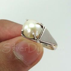 Important : PLEASE ENTER YOUR PHONE NUMBER IN THE "NOTE TO SELLER" SECTION DURING CHECKOUT, SO THAT THE DELIVERY CAN BE HASSLE FREE.Stone : PearlMetal : 925 Sterling SilverStone Size : 8mm ( Can be customized as per your need)Shape : RoundBand Size : 2mmShips worldwide from India925 stampedHandmade ItemSTYLE STATEMENTBe it ethnic or casual wear, this ring is sure to add style to your look. Match it with any attire and stay trending at all times.CUSTOMIZATIONWe welcome customization.Change in gem Sterling Silver Pearl Ring With Polished Finish, Sterling Silver Open Pearl Ring With Polished Finish, Silver Sterling Silver Pearl Ring With Polished Finish, Sterling Silver Pearl Ring With Polished Finish For Anniversary, Sterling Silver Pearl Ring With Pearl Drop, Oval Sterling Silver Hallmarked Pearl Ring, Hallmarked Oval Pearl Ring In Sterling Silver, Hallmarked Sterling Silver Oval Pearl Ring, Sterling Silver Open Ring Pearl Ring For Formal Events