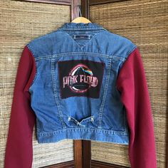 Upcycled denim jacket, size women's XS to small, with Pink Floyd patch on back and magenta sweatshirt sleeves.  This is a cute vintage retro jacket which would make a great concert or festival outfit for any rock band lover! (WANT TO SEE MORE FROM THIS COLLECTION? Type PWJG in this store's search field.) PLEASE NOTE:  All patches are machine sewn onto the jacket with raw, unfinished edges to create a more distressed, tattered look.  All patchwork jackets have been washed and dried again after applying patches.  However, some additional fraying of patches may still occur after laundering which just adds to the distressed look. DETAILS: Size:  Women's size XS-S (depending on desired fit) Brand:  Tommy Jeans Materials:  Cotton MEASUREMENTS: Width from armpit to armpit:  17-1/2 inches Length f 90s Style Cotton Denim Jacket For Winter, 90s Cotton Outerwear For Spring, 90s Spring Cotton Outerwear, 90s Style Cotton Spring Outerwear, Y2k Denim Jacket For Fall Streetwear, Fall Cotton Denim Jacket In Grunge Style, Fall Cotton Grunge Denim Jacket, Y2k Cotton Outerwear For Fall, Retro Patchwork Denim Jacket For Fall