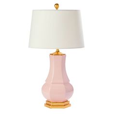 a pink lamp with a white shade on it