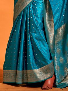 Wear this designer saree in a stunning sky-blue color, made from luxurious silk material, adorned with exquisite zari weaving work and attached tassels. This adorable sky-blue zari-weaving satin wedding wear saree is perfect for creating fashion statements at festivals, weddings, and events.
The set includes a blouse made from the same color silk material with zari weaving work. The saree measures 5.50 meters, allowing for versatile draping styles, and the blouse material is unstitched, providin Blue Bollywood Banarasi Silk Pre-draped Saree, Blue Wedding Pre-draped Saree With Zari Weaving, Blue Paithani Silk Pre-draped Saree With Traditional Drape, Blue Katan Silk Pre-draped Saree With Zari Work, Elegant Blue Pre-draped Saree For Puja, Blue Dola Silk Pre-draped Saree With Pallu, Blue Silk Pre-draped Saree For Traditional Ceremonies, Blue Dola Silk Pre-draped Saree With Zari Weaving, Blue Pre-draped Saree With Zari Weaving