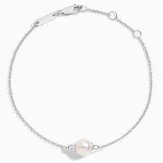 Premium Akoya Cultured Pearl Bracelet (7mm) - Silver. Both classic and elegant, this bracelet features a lustrous Akoya cultured pearl held on a delicate cable chain. The length of the bracelet can be adjusted from 6 to 7 inches to suit individual preference. Timeless Silver Pearl Bracelets, Elegant White Chain Bracelet With Pearl Charm, Classic Sterling Silver Pearl Bracelet For Gift, Classic Sterling Silver Pearl Bracelet As Gift, Sterling Silver White Gold Bracelets With Pearl Chain, White Gold Sterling Silver Bracelets With Pearl Chain, White Gold Sterling Silver Bracelet With Pearl Chain, Classic White Chain Bracelet With Pearl Drop, Formal Sterling Silver Pearl Drop Bracelet