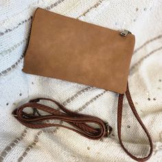 Simply understated, but so many pockets and room to hold all of your essentials! The fun warm brown color adds a fun pop to this classic style. It has a zip closure, a detachable wrist or shoulder strap that can be worn on the shoulder or crossbody, and supple faux suede. Shipping Free standard shipping on all orders of $150 or more! Free In-store Pick-up- This is a wonderful option if you live in the area! Orders are typically processed within a couple of hours during business hours. If an orde Casual Brown Bag With Zipper Pouch, Brown Bags With Zipper Closure For Fall, Brown Fall Bags With Zipper Pocket, Brown Bags With Zipper Pocket For Fall, Suede Clutch, Warm Brown, Brown Color, Faux Suede, Classic Style