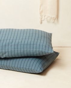 two pillows sitting on top of each other