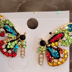 Bright Crystals In Red, Blue, Green, Clear, Black And Dark Yellow Adorn These Cheerful And Unique Earrings. Nwt Multicolor Butterfly Earrings For Pierced Ears, Multicolor Butterfly Earrings For Party, Butterfly Stud Earrings, Crystal Butterfly, Butterfly Earrings Stud, Dark Yellow, Source Unknown, Red Blue Green, Unique Earrings