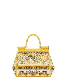 Dolce & Gabbana Medium Sicily Top Handle Bag in Yellow Majolica Magnetic flap closure Top carry handle Adjustable shoulder strap Interior wall pocket Fabric outer and upper 10”W x 9”H x 4”D 20” strap drop Made in Italy Luxury Yellow Bag With Top Carry Handle, Designer Yellow Bag With Top Carry Handle, Luxury Yellow Crossbody Satchel, Designer Yellow Satchel With Detachable Strap, Yellow Shoulder Bag With Top Handle And Handle Drop, Luxury Yellow Crossbody Bag, Yellow Top Handle Satchel With Handles, Yellow Crossbody Satchel With Handle Drop, Yellow Top Handle Satchel With Detachable Strap