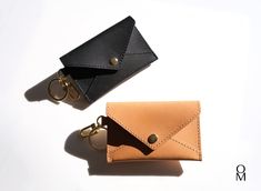 Elevate your nights out with our exquisite Italian leather cardholder wallet.  Crafted from top grain leather, this sleek accessory accommodates four cards and paper cash effortlessly, making it perfect for those occasions when you want to travel light.  Designed with a discerning eye for detail, our wallet features oil-edged finishing, luxurious gold hardware akin to high-end brands, and a sumptuously soft velvet-like interior that cradles your essentials with care.  The snap button closure ens Luxury Leather Elegant Wallet On Chain, Luxury Elegant Leather Wallet On Chain, Elegant Luxury Wallet On Chain With Branded Hardware, Luxury Elegant Wallets With Branded Hardware, Luxury Leather Wallet On Chain With Chain Detail, Cardholder Wallet, Wallet Keychain, Minimal Wallet, Leather Cardholder