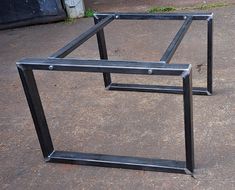 two metal frames sitting on the ground