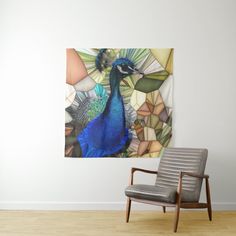 a peacock sitting on top of a wooden chair next to a wall mounted painting in an empty room