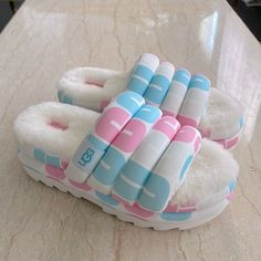 Brand New With Tag Ugg Pink/Blue Slide. Set On A Maximalist 2.5" Sole, It Offers A Leg-Lengthening Look And Ultra-Cushioned Step. Pair With Shorts, Crop-Tops, And More The Styling Options Are Endless. Size 9. Box Is Not Included. New, Never Been Worn. Retail:$130 Plus Tax Cute Comfort Shoes, Shoes For Vacation, Multicolored Aesthetic, Cute Uggs, Ugg Leather Boots, Fluffy Shoes, Teen Swag Outfits, Bf Gifts, Shoes Outfit Fashion