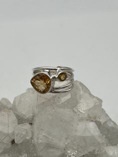 Abstract Citrine Ring, Size 6 1/2 Citrine is a joyful stone with bright energy which lights up many aspects of lives of those who work with it. It has energies of good fortune and good luck, though these may appear in unexpected ways. 925 Sterling Silver WWW.KARINSFORGOTTENTREASURES.COM Spiritual Oval Citrine Ring, Oval Citrine Ring With Spiritual Style, Spiritual Yellow Gemstone Rings, Spiritual Citrine Gemstone Rings, Spiritual Citrine Rings For Anniversary, Spiritual Amber Citrine Rings, Unique Citrine Rings With Accent Stones, Spiritual Sterling Silver Topaz Ring With Gemstone Details, Spiritual Topaz Gemstone Ring As Gift