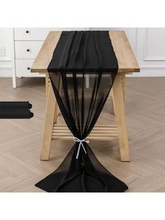 a table with black cloth on it