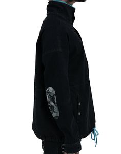 Creator's Note- Perfect anorak with comfortable pocket and neck interlining. Quantity Made- Only 100 Collection- Dawn of an Era Details- Pull string around waist hem- Hidden zipper down center- Mock neck- Neck artwork embroidered- Imported Fabric- Shell Fabric: 73% cotton / 24% polyester / 3% spandex- Combo Fabric: 100% polyester Fit- True to size Cotton Half-zip Outerwear For Outdoor, Black Fall Parka With Cargo Pockets, Fall Black Parka With Cargo Pockets, Black Cotton Windbreaker With Stand Collar, Black Cotton Parka With Detachable Hood, Casual Parka With Stand Collar For Streetwear, Urban Utility Jacket With Stand Collar For Streetwear, Black Utility Jacket With Patch Pockets For Streetwear, Casual Streetwear Parka With Stand Collar