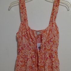 Brand: American Eagle Outfitters Color: Multicolor Floral Print (Orange, Pink, White Colors) Size: S Material: Shell: 100% Viscose Fabriqu: Made In India Care: Machine Wash Cold This Is A Beautiful Multicolor Lining Sun Dress With Sleeveless With Elastic Straps, Fit And Flare, Open Front Henley Neck With Spaghetti Straps For Closure, An Elastic Band On The Rear Waistline, Have A Side Pocket, And A Ruffle On Bottom Hem. From The Shoulder To The Bottom Hem Is 31 Inches In Length. Please Feel Free Pink Sleeveless Sundress For Summer, Orange Sleeveless Sundress For Spring, Fitted Sleeveless Orange Sundress, Cotton Floral Print Sleeveless Sundress, Peach Sleeveless Sundress For Vacation, Sleeveless Orange Floral Print Dress, Peach Sleeveless Sundress For The Beach, Peach Sleeveless Beach Sundress, Sleeveless Orange Dress With Floral Print