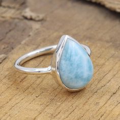 Larimar Ring, Solid Silver Ring, Moonstone Ring, Rutilated Quartz Ring, Birthstone Ring, Women's Rings, Solitaire Rings, Best Gift For Her Larimar ring, intricately set in solid silver. Featuring a mesmerizing moonstone and a unique rutilated quartz, this birthstone solitaire ring is a perfect gift for her. Stand out with this one-of-a-kind women's ring - the best present she'll ever receive! Item: Handcrafted Women's Birthstone Ring - Larimar Moonstone Rutilated Quartz Solitaire Jewelry Ring si Rings Solitaire, Larimar Ring, Larimar Rings, Solitaire Rings, Women's Rings, Ring Birthstone, Promise Rings For Her, Best Gifts For Her, Statement Ring Silver