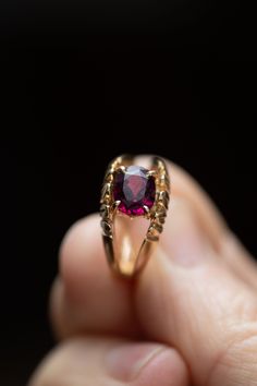 14k gold tested oval garnet ring with a split shank setting. The garnet is being held with 4 prongs. The garnet is quite large and placed sideways instead of vertically. The setting has 6 leaf type designs on the outside of the shank.  Size 6 US 4.5 grams stone size : 8mm x 6mm 👋🏽 I charge an additional $50 if you are interested in having this ring resized. There is a 2 week (or less) turn around time. Please go to this listing https://www.etsy.com/ca/listing/1068711810/ring-sizing-available?r Classic Oval Ruby Ring With Diamond Cut, Heirloom Oval Ruby Ring With Diamond Cut, Gold Ruby Ring, Oval Diamond Cut, Victorian Oval Birthstone Ring In Yellow Gold, Victorian Oval Yellow Gold Birthstone Ring, Hallmarked Oval Birthstone Ring In 14k Gold, Victorian Yellow Gold Oval Birthstone Ring, Oval Ruby Ring In 14k Gold, Heirloom 14k Gold Oval Ruby Ring