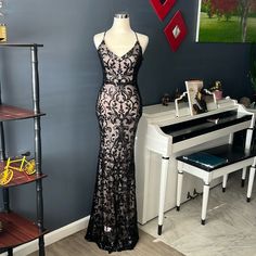 Beautiful Long Party Dress Lined With Sequin V-Neck And Cross Back And Back Zipper In The Back With Label New Black V-neck Evening Dress For Night Out, Black V-neck Evening Dress For Party Season, Black Lace V-neck Evening Dress, Black Backless Evening Dress For Spring, Lace V-neck Maxi Dress For Party, Lace V-neck Evening Dress For Party, Party Lace V-neck Maxi Dress, Black V-neck Evening Dress For Spring, Black Lace Backless Maxi Dress