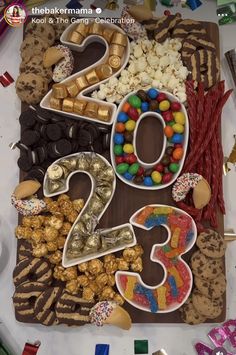 a table topped with lots of different types of candy and cookies on top of it