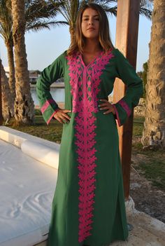 A stunning embroidered Kaftan dress that is elegant, colorful, and unique! The dress is made of Egyptian cotton that has a soft feel to it so you will surely feel comfortable and royal in it. It also comes with a small invisible pocket on the right side of the Kaftan for added practicality. You can wear this Kaftan practically anywhere and for any occasion. You can dress it up with a pair of heels and strut like an Egyptian queen in any gathering, resort, or party. Or you can dress it down with Traditional Long Sleeve Maxi Dress With Multicolor Embroidery, Long Sleeve Dress With Embroidered Border For Festivals, Traditional Green Long Sleeve Maxi Dress, Traditional Pink Long Sleeve Kaftan, Traditional Long Sleeve Green Maxi Dress, Traditional Long Sleeve Pink Kaftan, Green Tunic Kaftan For Festivals, Traditional Pink Embroidered Long Sleeve Dress, Traditional Pink Long Sleeve Abaya