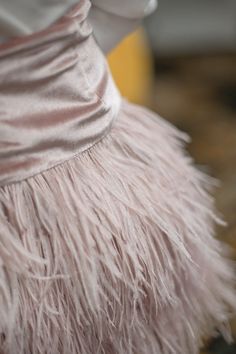 This stylish Dusty Pink Feather Skirt is the perfect item for your little girl's wardrobe. Crafted from a combination of dusty pink velour and plush ostrich feathers, it is sure to make any occasion special. The high-quality materials make this skirt sure to last and will always bring a special touch to any look. 92% Polyester, 8% Spandex, dyed Ostrich Feathers Color is dusty pink Fully lined Imported Fit is true to size, above the knee Care Instructions: Hand wash in cold water and mild deterge Pink Feather Skirt, Ostrich Feather Skirt, Knee Care, Feather Skirt, Pink Feathers, Ostrich Feather, Colorful Feathers, Ostrich Feathers