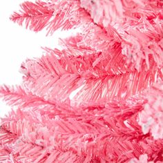 a pink christmas tree is shown against a white background