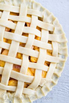 an apple pie with latticed crust on top