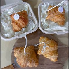 three plastic containers with pastries in them