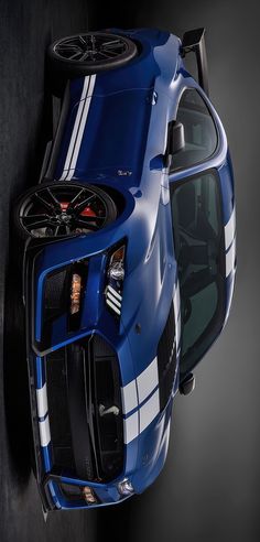 the rear end of a blue sports car