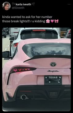 the back end of a pink sports car