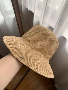 This hat is based on raffia straw, and the overall design is fresh and natural, suitable for daily wear. The hat is made of light straw, which is breathable and suitable for summer use. It is both practical and fashionable. Its wide brim provides good sun protection and can effectively block strong sunlight. At the same time, the edge of the brim has a slight wave feeling, adding a soft temperament. The surface of the hat is dotted with some colorful embroidery patterns, which adds fun and perso Multicolor Bucket Hat For Beach, Multicolor Bucket Hat For The Beach, Spring Bucket Hat Made Of Straw, Trendy Straw Bucket Hat For Spring, Casual Toquilla Straw Bucket Hat For Spring, Spring Casual Toquilla Straw Bucket Hat, Trendy Spring Straw Bucket Hat, Casual Beige Paper Straw Boater Hat, Spring Beige Straw Bucket Hat