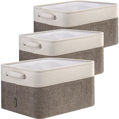 two storage baskets with handles on each side, one in grey and the other in white