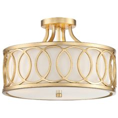 a semi flush light fixture with white and gold trimmings on the bottom half