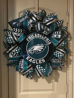 the philadelphia eagles wreath is hanging on the front door, and it's made out of duct tape