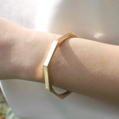 Elevate your accessory game with our solid gold geometric bracelet, available exclusively on Etsy. This unique and timeless cuff bangle is a perfect luxury gift for loved ones, and is sure to add sophistication to any outfit. Shop now and make a statement with this stunning piece of jewelry. Size: 60 mm Width (inside measurements) Material: 14K Gold Karat: 14 Karats Gold (585) BEST CHOICE FOR GIFT🎁 You can buy the best gifts for your loved ones from this shop with our special packaging that we use for each product. DELIVERY🚀 Your order will be crafted and ready to ship within 1 - 5 business days.We use express shipping for all orders.Please contact us if you have any urgency. Estimated delivery time: USA 1-3 days EU   1-3 days AUSTRALİA  2-7 days CANADA  2-4 days Other 2-8 days Elegant Geometric Bracelets Gift, Elegant Geometric Bracelets For Gift, Elegant Geometric Bracelets For Gifts, Gold Geometric Bracelet For Gift, Elegant Adjustable Geometric Bracelet, Modern 14k Gold Bangle As Gift, Modern 14k Gold Cuff Bracelet As Gift, Modern 14k Gold Cuff Bracelet Gift, Modern 14k Gold Cuff Bracelet For Gifts